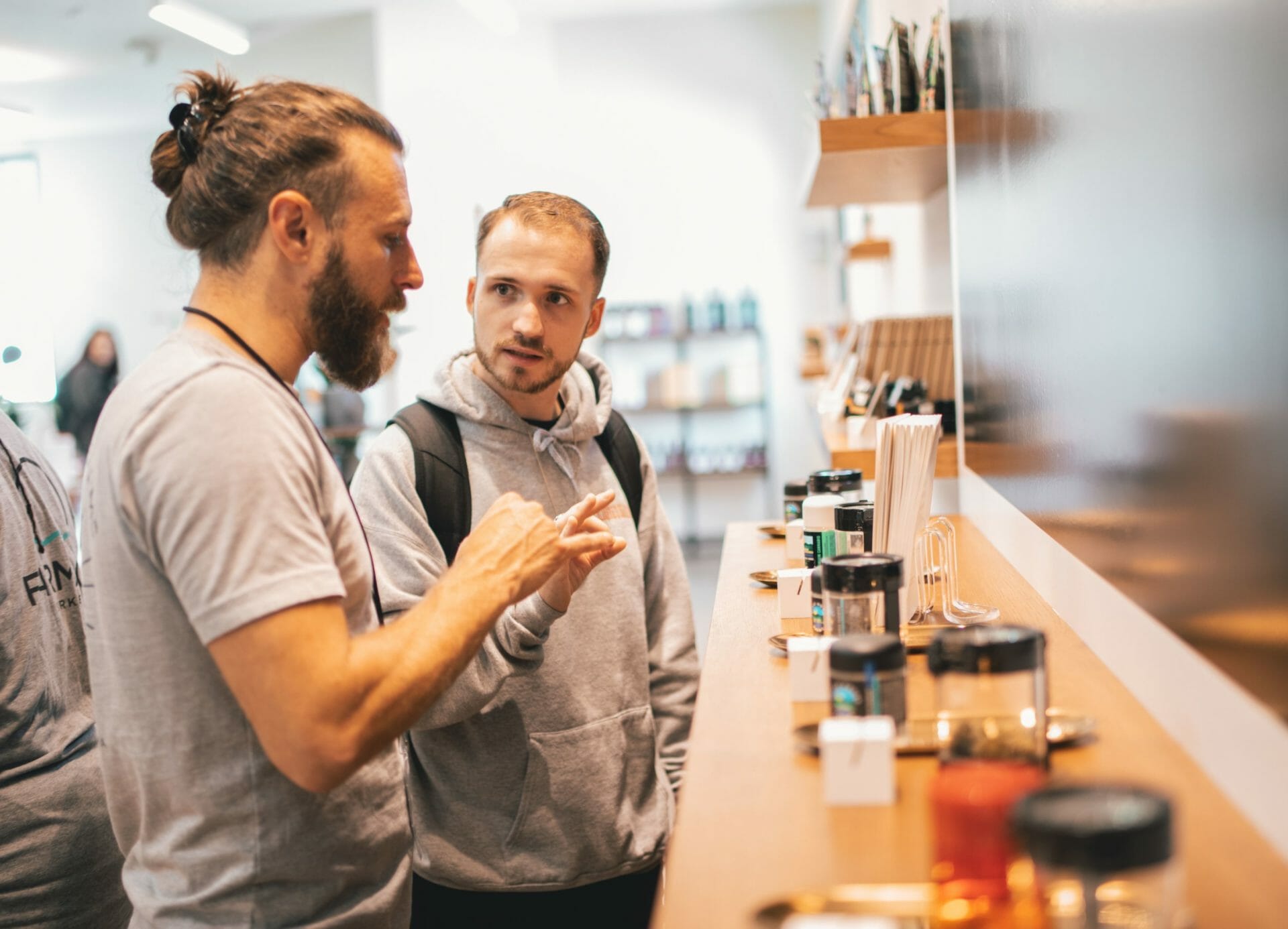 The team at the dispensary in Berkeley helps a customer understand more about cannabis